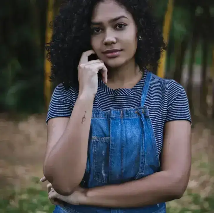 Portrait of a young lady with
          curly hair 